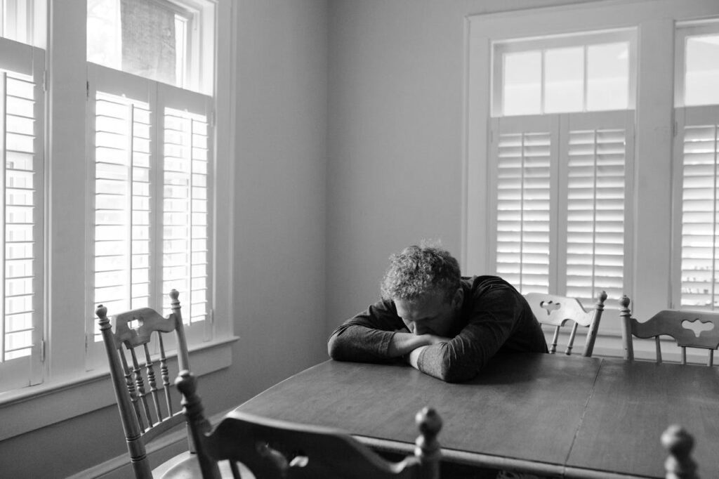 Lonely Adult Male on Dinning Table